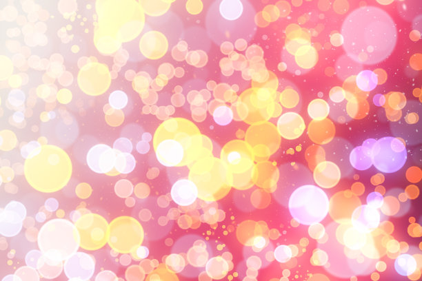 金色的散景光在黑色背景上。图片下载