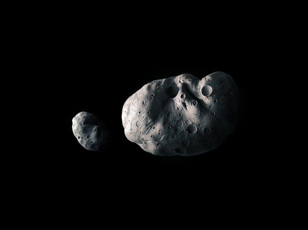 大大小小的小行星在黑色的背景上。图片下载