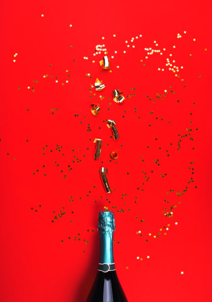 绿色的香槟酒瓶，红色的飘带图片下载