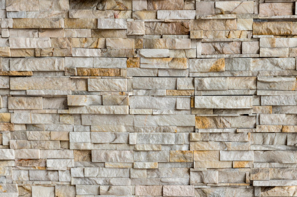 石材墙面纹理背景颜色自然。背景的石墙纹理照片。天然石材墙面纹理为背景。旧砖纹理，垃圾砖墙背景。图片下载