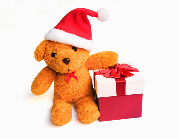 可爱的棕熊穿着圣诞老人的衣服和帽子。快乐的微笑与许多彩色的礼盒孤立在白色的背景，圣诞节和新年的礼物图片下载