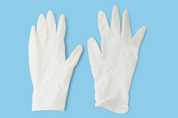 蓝色背景的白手套-冠状病毒疫情预防图片下载