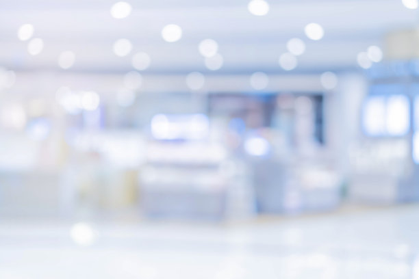 抽象模糊软焦点蓝色室内现代清洁工作场所的背景与橙色发光的设计理念图片下载