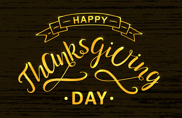 感恩节快乐手写字母，现代毛笔书法。用丝带和花饰装饰的。图片下载