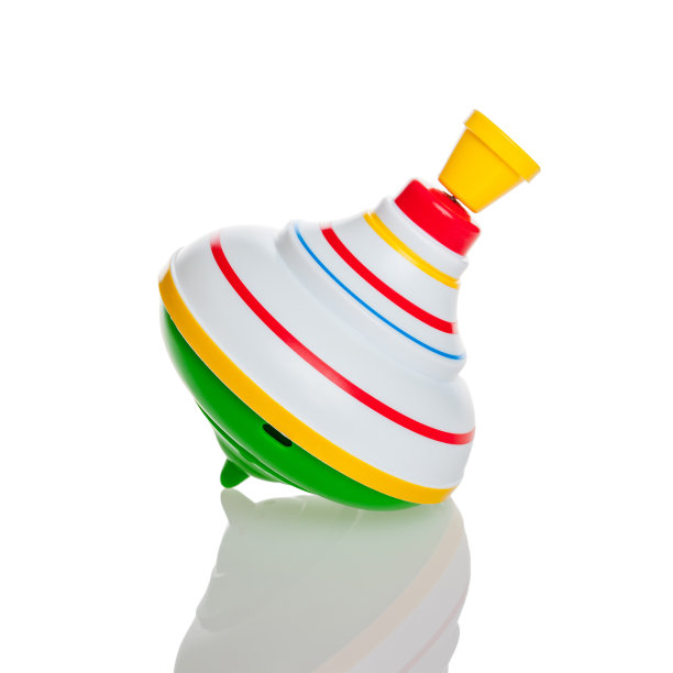 儿童玩具顶部孤立在白色背景上，色彩美丽的捆绑，儿童移动玩具，旋转顶部，陀螺仪，设计图片下载