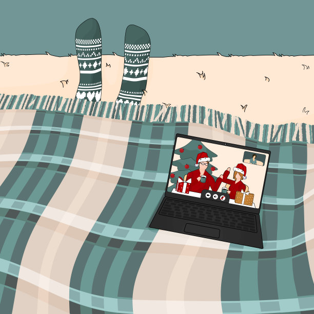 与家人或朋友在圣诞节新年时间视频通话。女人穿着绿蓝格子的针织短袜图片下载