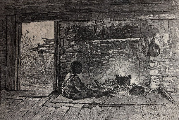 古董插图——一个年轻的黑人男孩坐在室内的火炉前图片下载