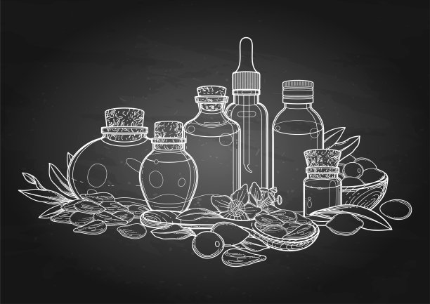 一组用枸杞浆果、树叶和花装饰的精油瓶。图片下载