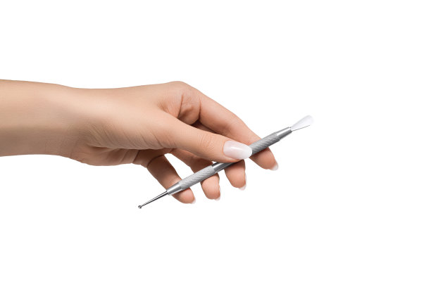 女性用完美的手握美甲工具。图片下载