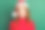 照片正面漂亮的女士看摄像头微笑穿红色套衫圣诞头饰孤立的绿色背景图片下载