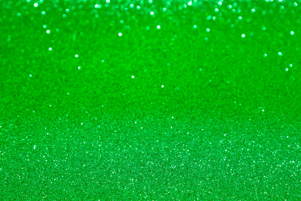 绿色亮片和散景背景。图片下载