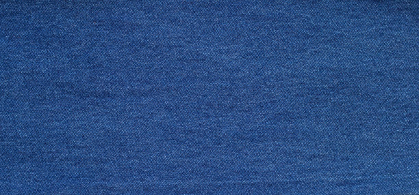 近距离蓝色牛仔裤纹理背景。图片下载