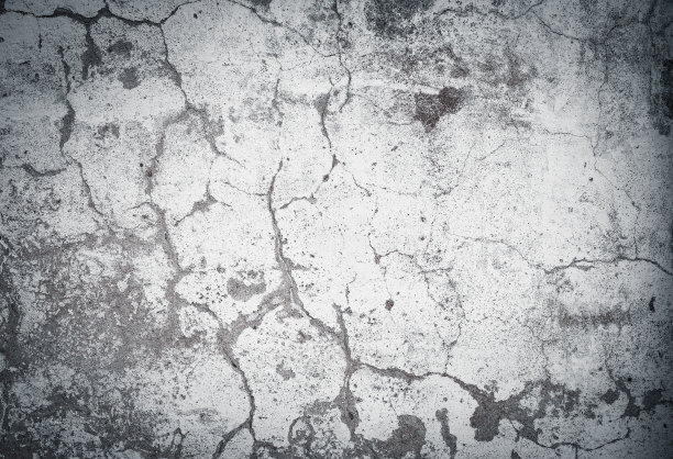 陈旧开裂的混凝土墙体纹理。饱经风霜的背景。图片下载