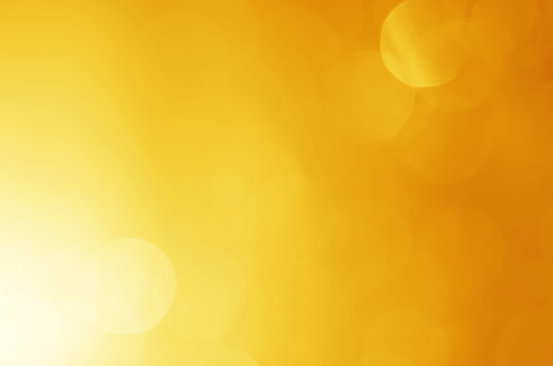 闪烁的灯光闪耀黄色金色华丽的散焦抽象背景闪亮。图片下载