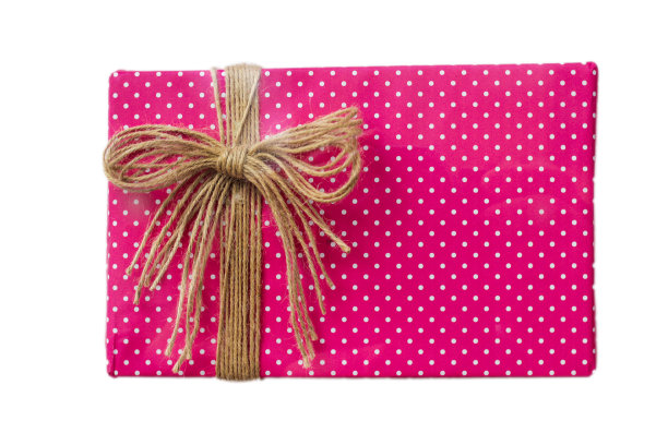 礼物在粉红色的包装和弓孤立在白色的背景。特写镜头图片下载