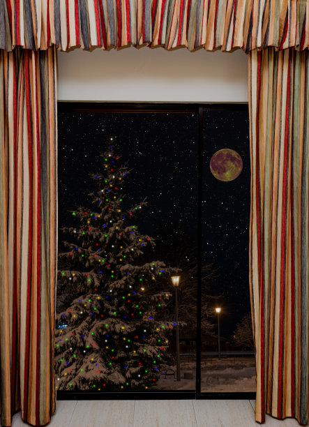 晚上圣诞树上装饰着一个彩色的花环图片下载