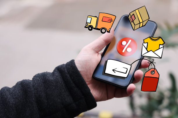 手持带有网购元素的智能手机图片下载