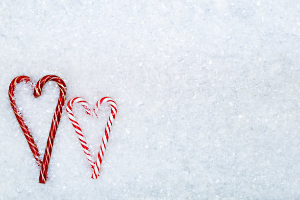 雪花背景的圣诞糖果手杖图片下载