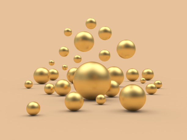 各种大小的金球落在米色上图片下载