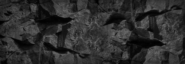 黑石的背景。岩石纹理。山表面的碎片。特写镜头。体积石垃圾背景。图片下载