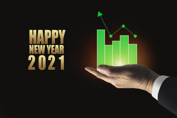 以2021年新年为背景，商人的手握着商业投资成长的成功标志。图片下载