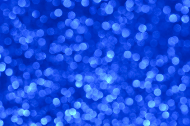 蓝色闪光背景与闪闪发光的纹理。图片下载