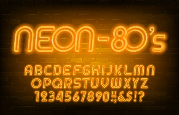 霓虹灯字母字体。80年代风格的黄色霓虹灯字母和数字。砖墙的背景。图片下载