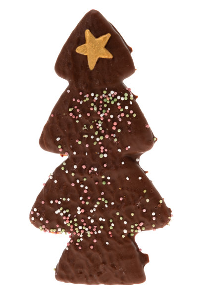 裹着牛奶巧克力的圣诞树形状的姜饼图片下载