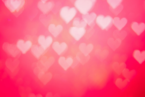 红色热辣，激情四射，魅力四射，背景明艳散景。心形的虚景红色抽象背景横幅。爱情主题说明。情人节的概念。副本的空间。装饰亮片设计。图片下载