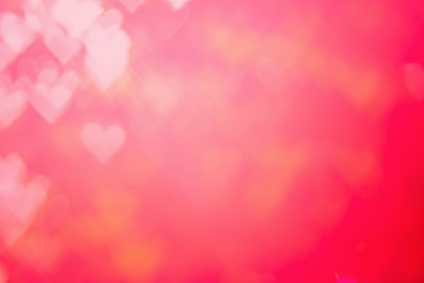 红色的热量热情和魅力明亮的散景背景。心形散角红色抽象背景横幅。爱情主题插图。情人节概念。副本的空间。装饰亮片设计。图片下载