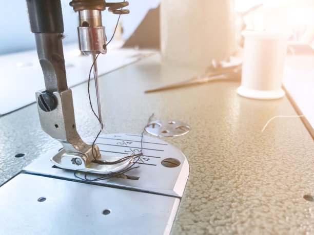 特写缝纫机图案纹理背景。图片下载