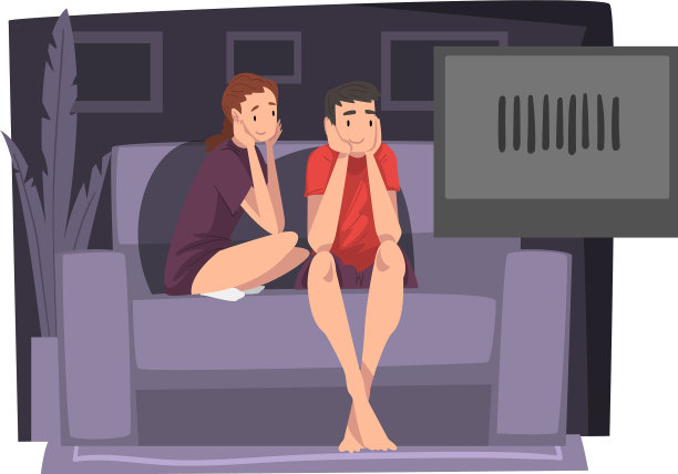 一对在沙发上一起看电影的年轻人图片下载