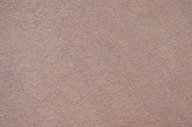 褐色砂石一种天然褐色砂石的平坦、粗糙的表面，带有斑点纹理图片下载