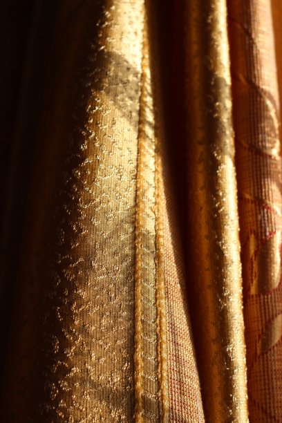 窗帘纹理特写纺织品设计金色织物在阳光图片下载