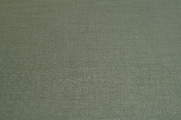 纹理背景由深绿色羊毛织物制成。水平方向图片下载