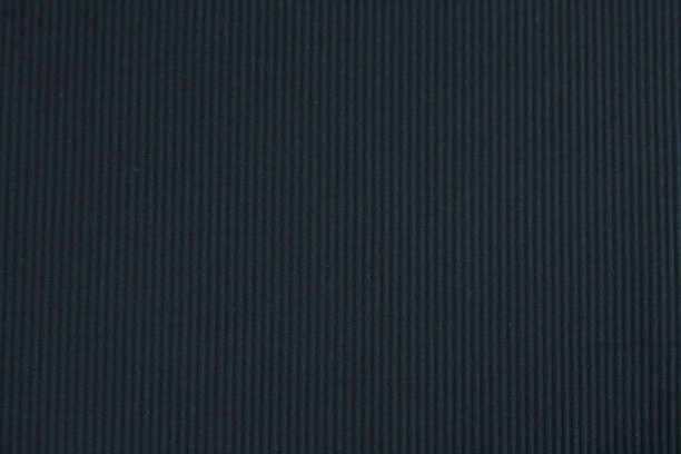 背景由纹理深色羊毛织物与精细的下摆为秋冬衣柜。水平方向图片下载