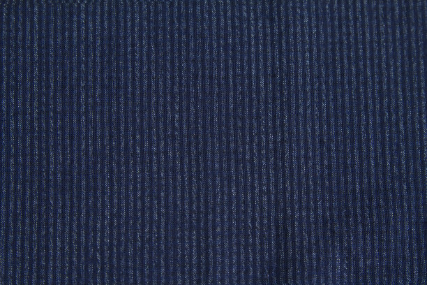 背景有纹理的羊毛面料在一个小的蓝色条纹秋冬衣柜。水平方向图片下载
