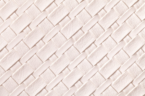 纹理浅粉色皮革背景与柳条图案，宏观。图片下载