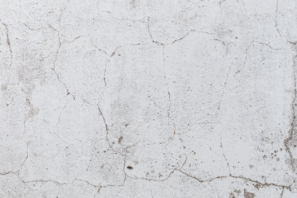 陈旧开裂的混凝土墙体纹理。饱经风霜的背景。图片下载