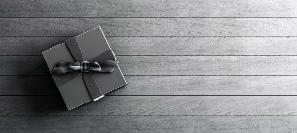 模拟海报，豪华的黑色礼盒与缎面黑色蝴蝶结在灰色的心疼木板背景，3D渲染，3D插图图片下载