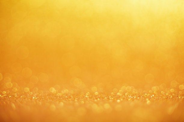 抽象模糊阳光明媚的夏日假日散景背景。假日概念背景与闪烁明亮的散景圈图片下载