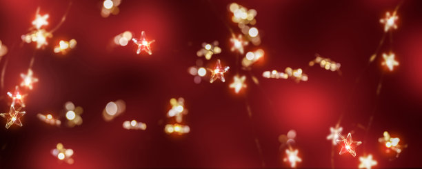 模糊闪亮的星星灯以红色为背景，圣诞灯以浪漫的心情为背景图片下载