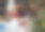 白色圣诞球与一个蝴蝶结和节日的其他装饰在白色羊毛与散克灯图片下载