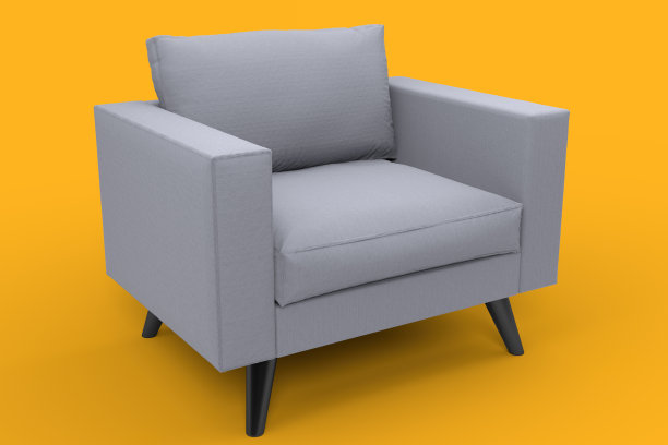 带枕头的灰色扶手椅，背景是工作室的黄色。图片下载