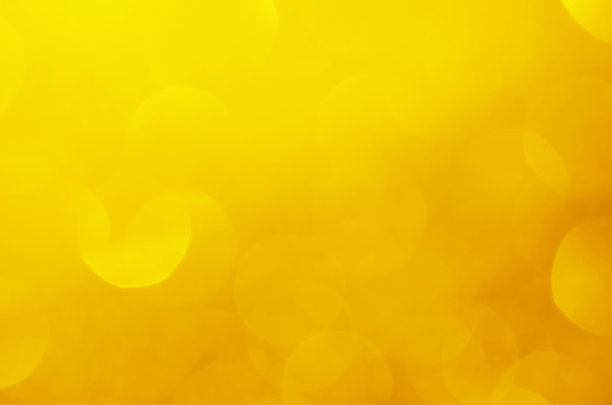 闪烁的灯光闪耀黄色金色华丽的散焦抽象背景闪亮。图片下载