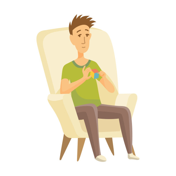 在家休闲的男孩坐在椅子上玩魔方图片下载