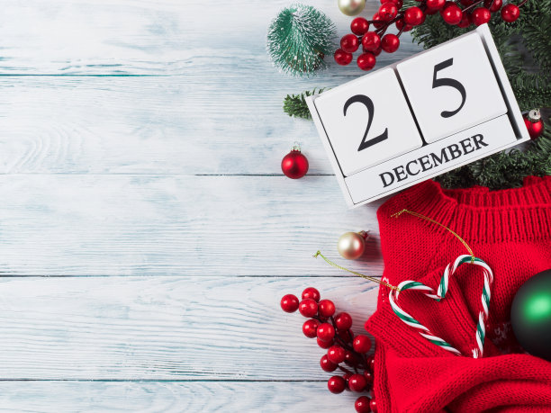节日的圣诞平铺在木头上用日历图片下载