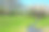 绿色的山谷景观和小河流与山脉的背景图片下载