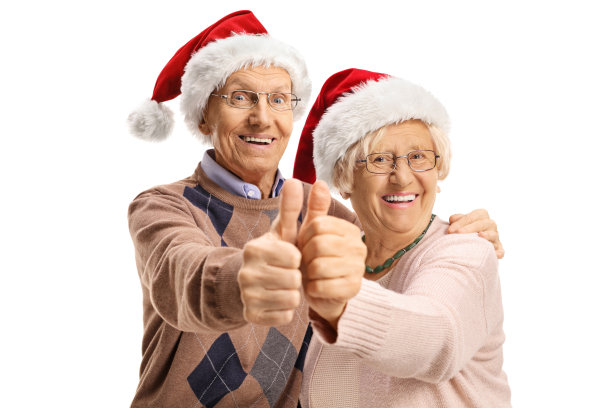 戴着圣诞帽的老夫妇竖起大拇指图片下载
