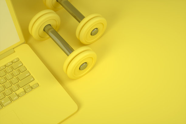 笔记本电脑，哑铃重量，健身，健康的生活方式概念图片下载